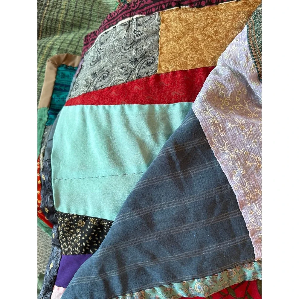 Old crazy Quilt. Patchwork silky fabrics